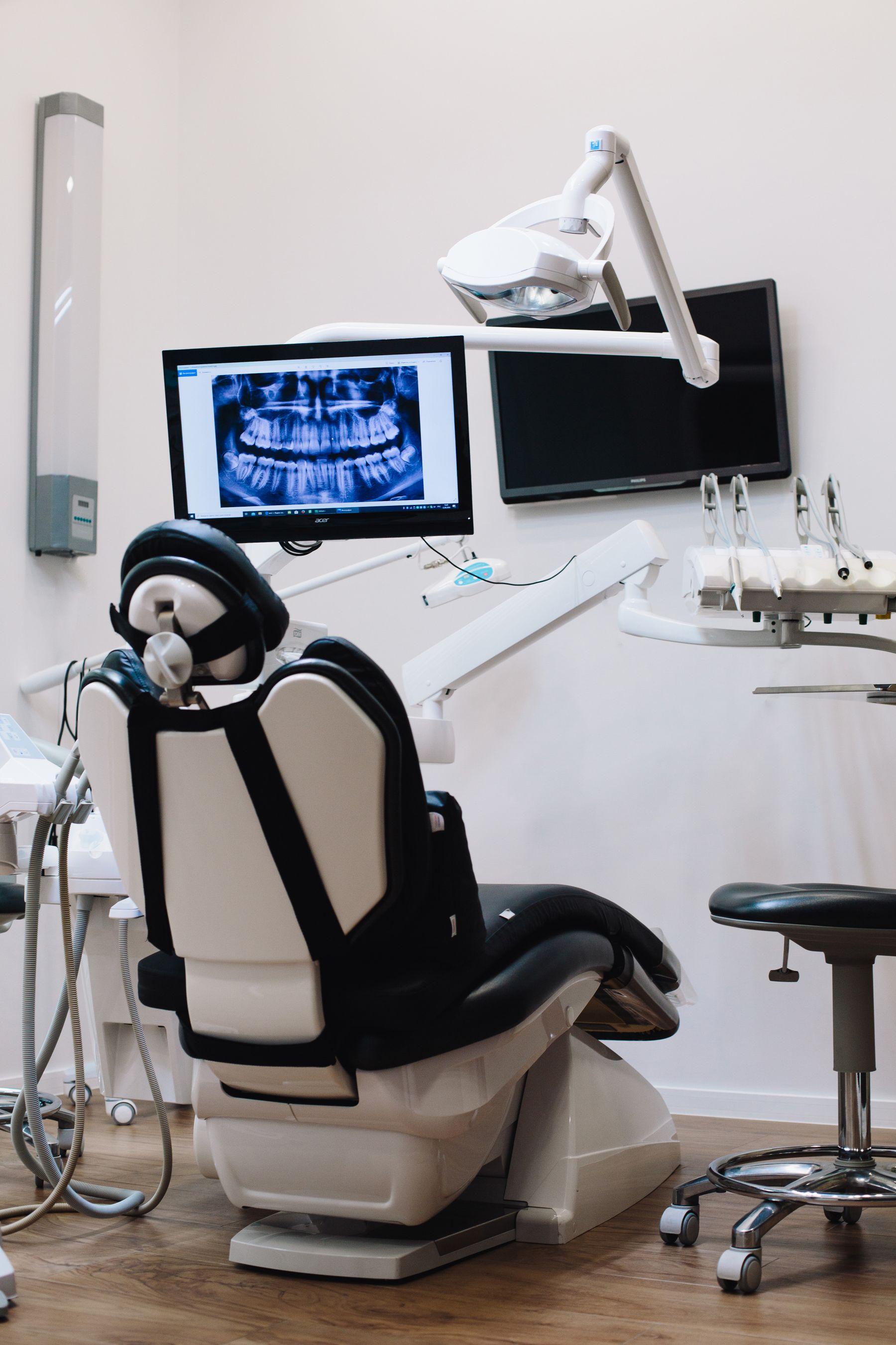 A dental clinic console with a screen showing an intraoral view